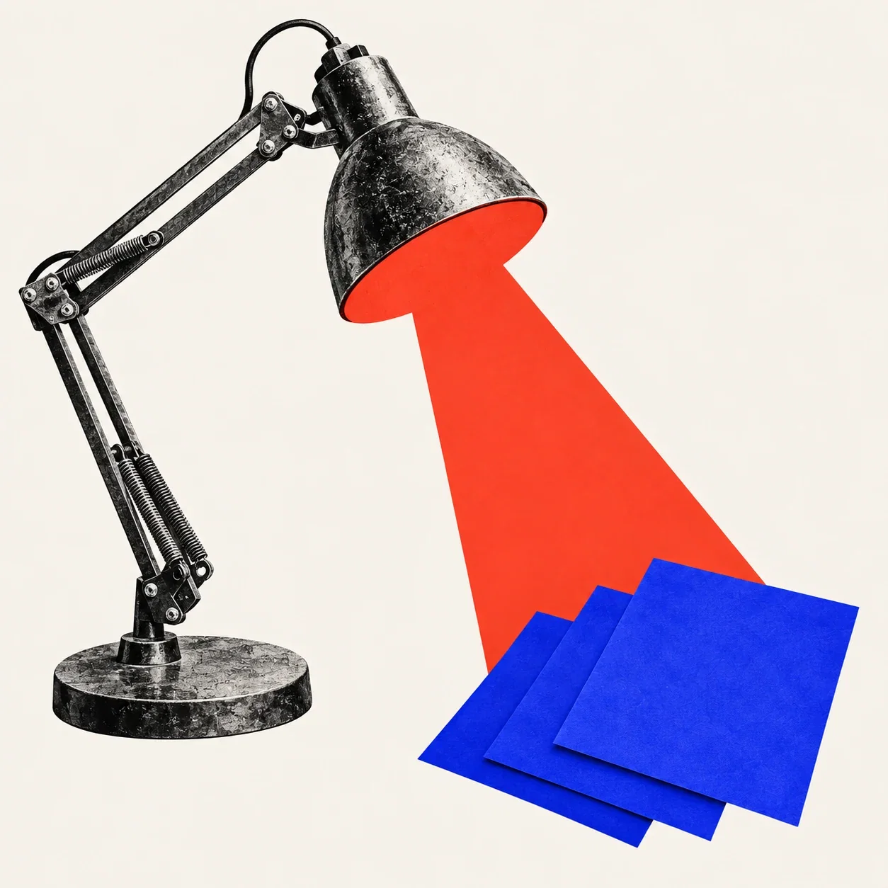 An inspection lamp illuminating three blue pages