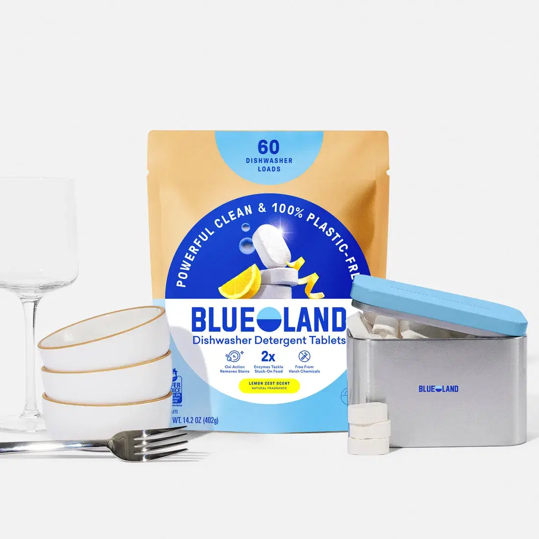Blueland dishwasher tablets, refill packaging and storage tin shown together.