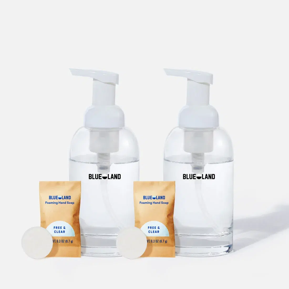 Two Blueland hand soap bottles with their refill packets.